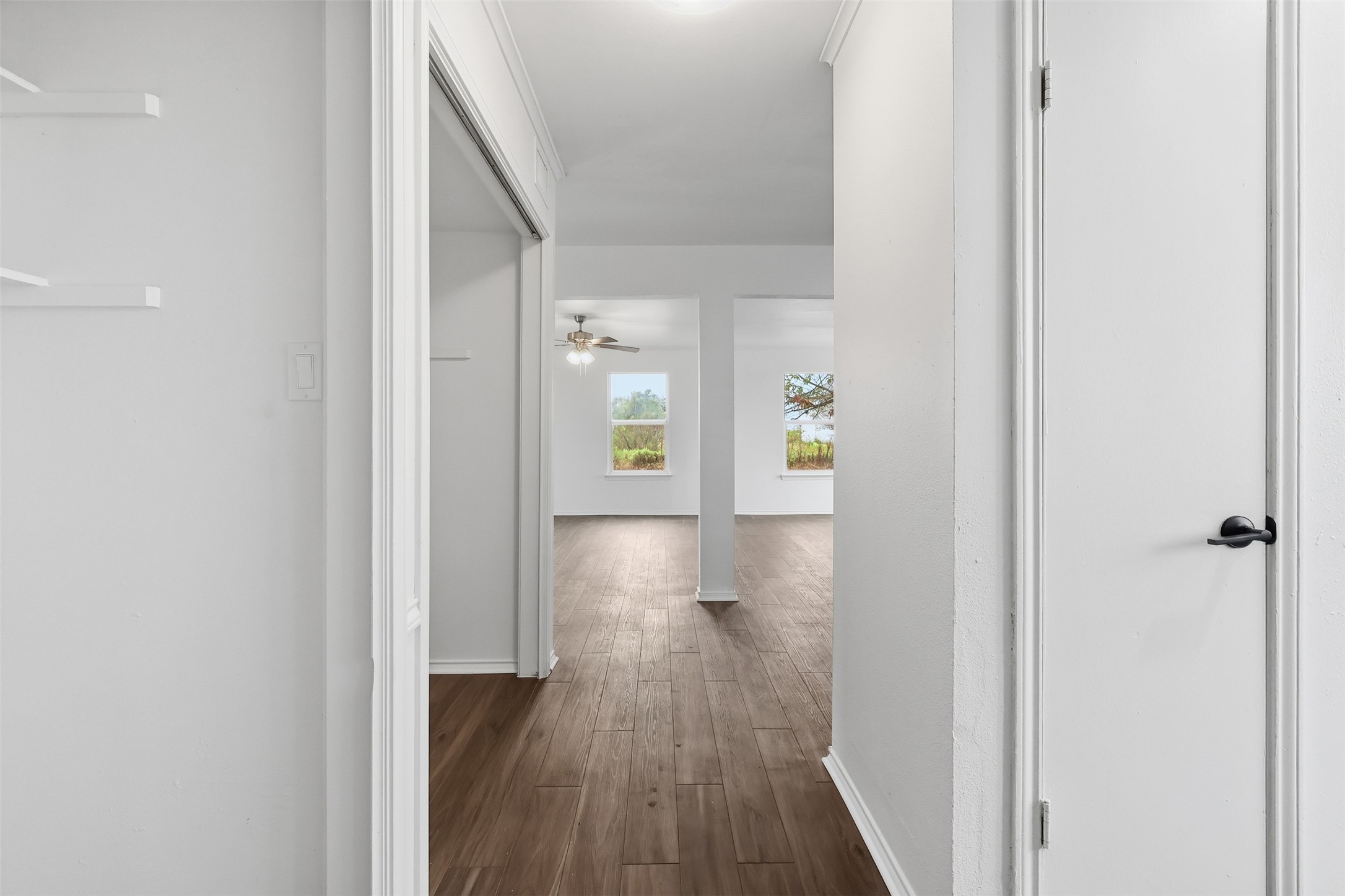 13201 Jacobson Road Manor, TX 78653 - Photo 3 of 25 a view of a hallway with wooden floor and staircase