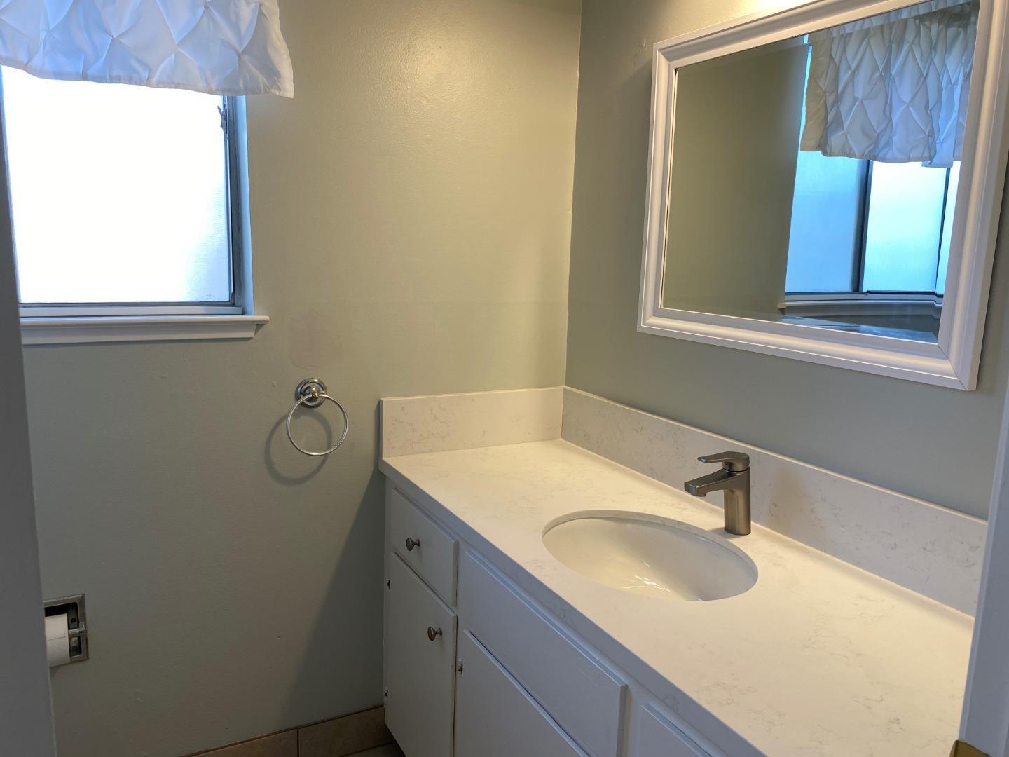 625 Comet Drive Foster City, CA 94404 - Photo 13 of 14 a bathroom with a sink and a mirror