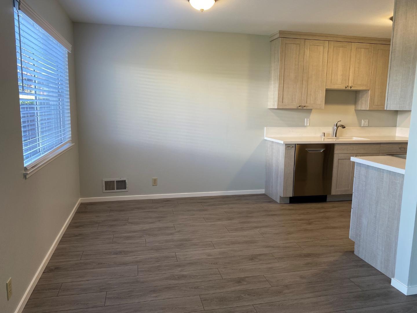 625 Comet Drive Foster City, CA 94404 - Photo 5 of 14 a view of kitchen with granite countertop white cabinets and white appliances