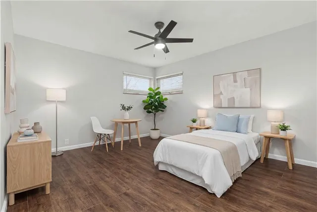 a bedroom with a bed and a table