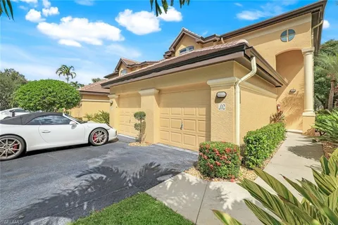 a view of a car parked in front of a house