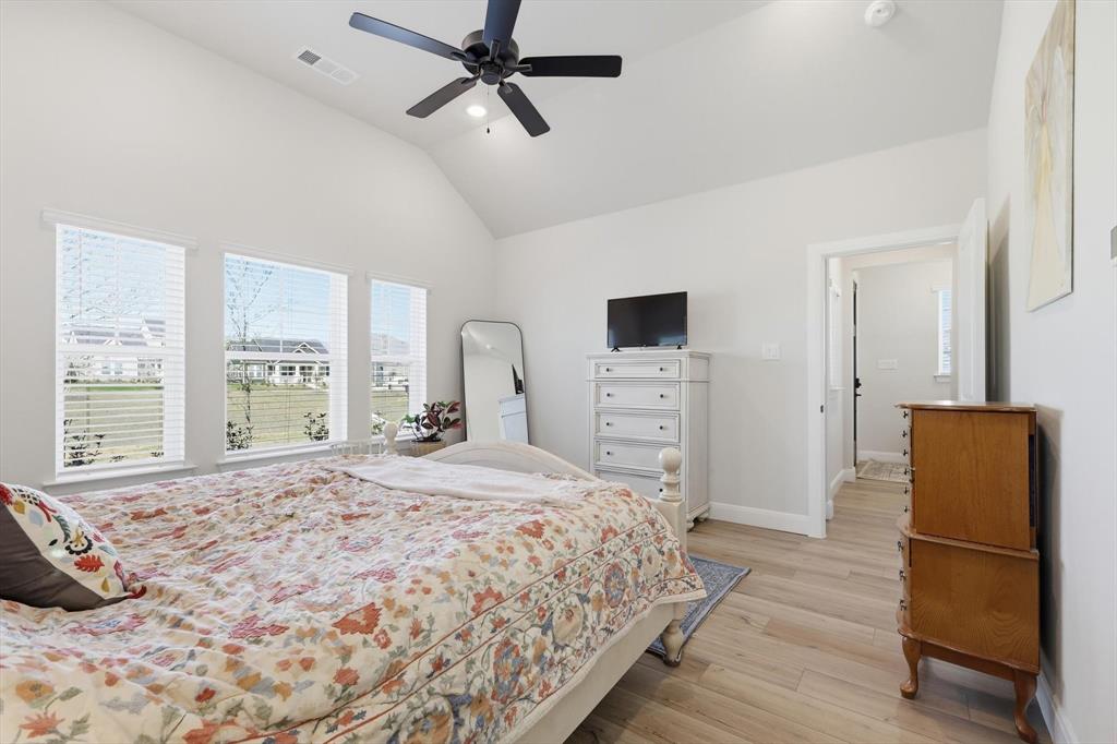 1018 Abigail Way Midlothian, TX 76065 - Photo 15 of 26 a bedroom with a bed and a television