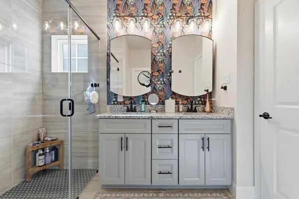 a bathroom with a sink and a mirror