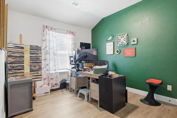 a view of a workspace with furniture