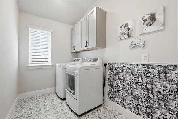 a utility room with a window dryer and washer