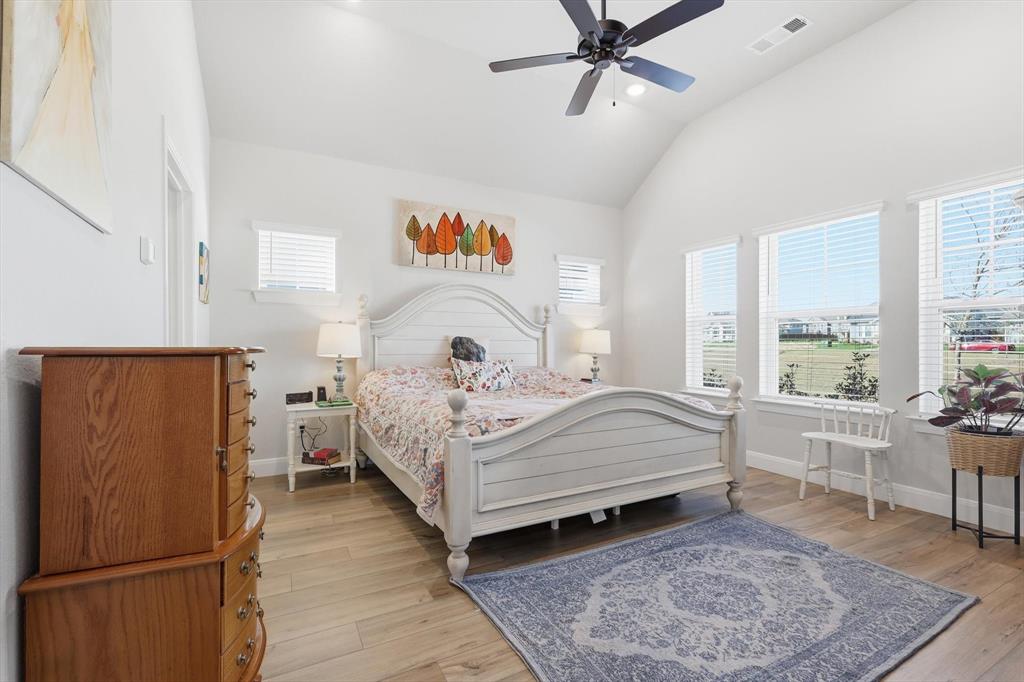 1018 Abigail Way Midlothian, TX 76065 - Photo 4 of 26 a bedroom with a bed and a table in it