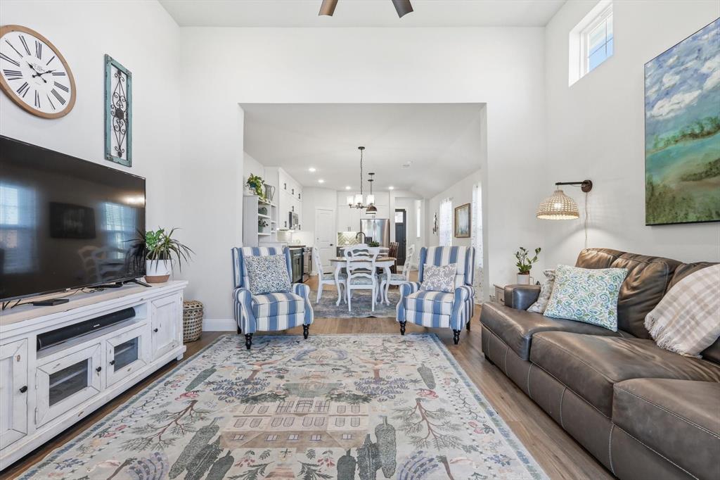 1018 Abigail Way Midlothian, TX 76065 - Photo 9 of 26 a living room with furniture and a flat screen tv