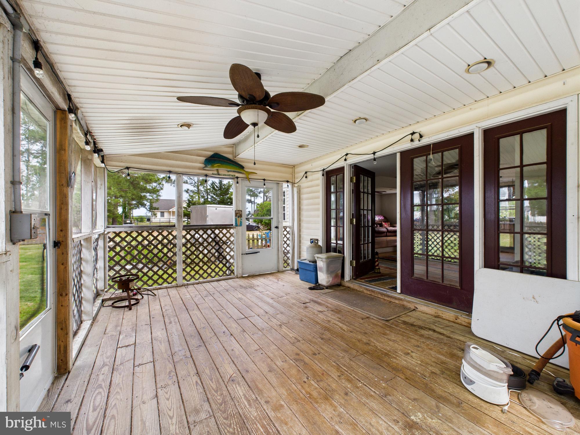11161 Roland Parks Road Chance, MD 21821 - Photo 52 of 58 Side yard screened in porch