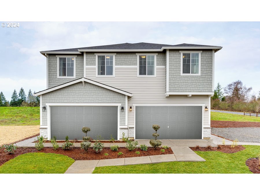 842 Northwest 178th Street Ridgefield, WA 98642 - Photo 1 of 46 a view of a house with backyard and road