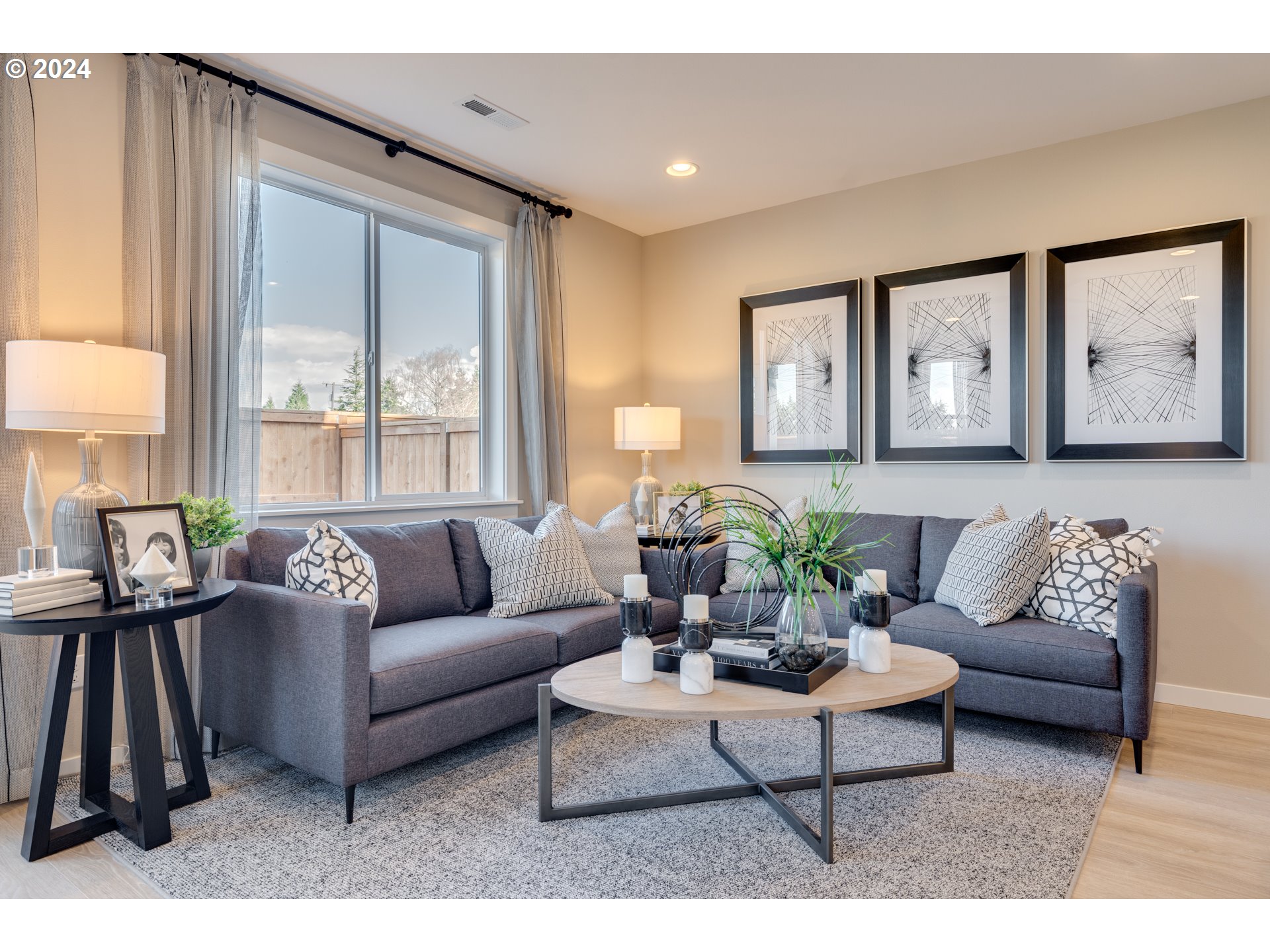 842 Northwest 178th Street Ridgefield, WA 98642 - Photo 12 of 46 a living room with furniture and large windows