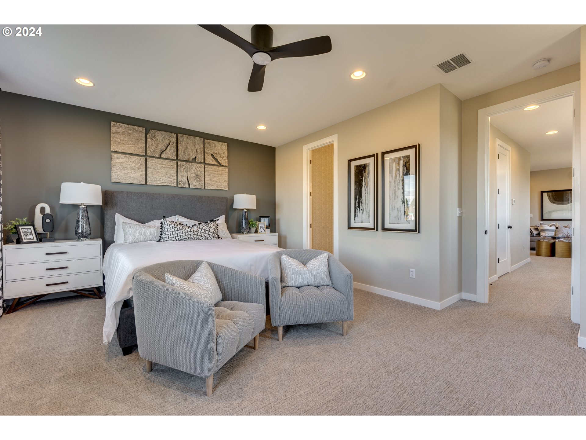 842 Northwest 178th Street Ridgefield, WA 98642 - Photo 21 of 46 a bedroom with a bed and a large mirror