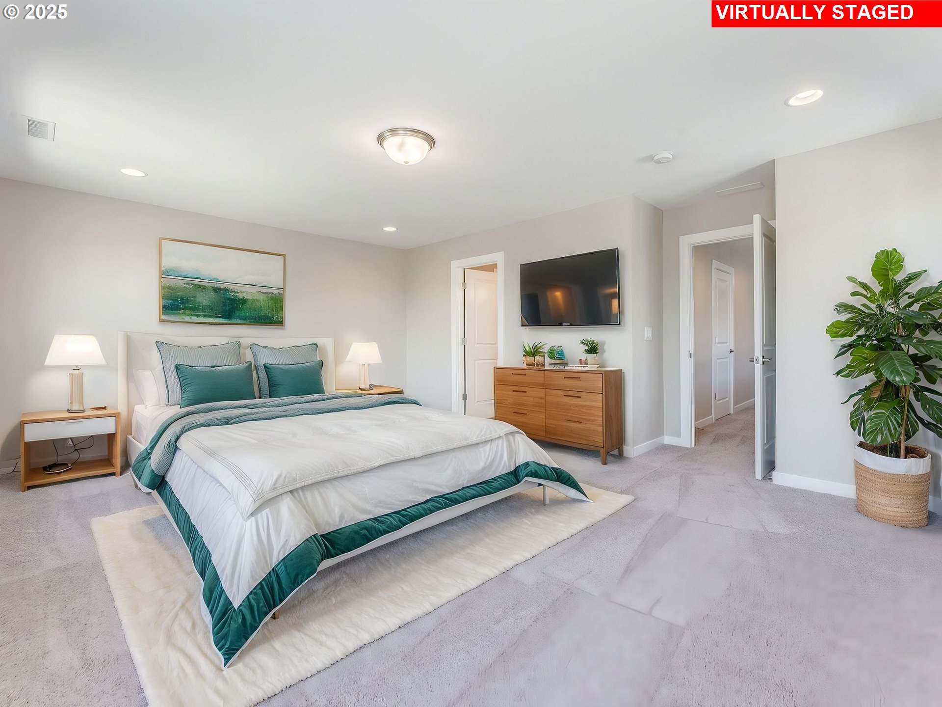 842 Northwest 178th Street Ridgefield, WA 98642 - Photo 36 of 46 a spacious bedroom with a bed and a flat screen tv
