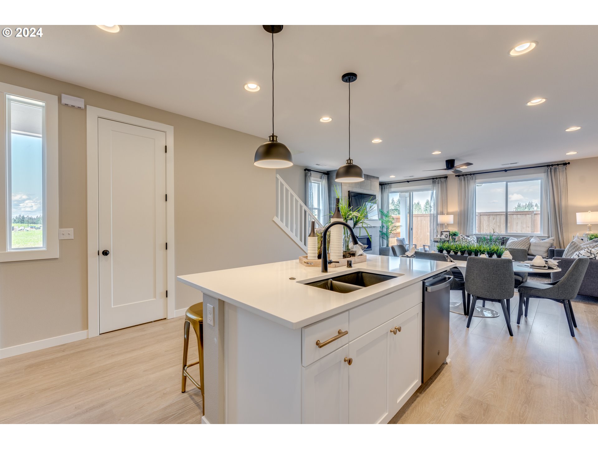 842 Northwest 178th Street Ridgefield, WA 98642 - Photo 5 of 46 a kitchen with a table chairs stove and wooden floor