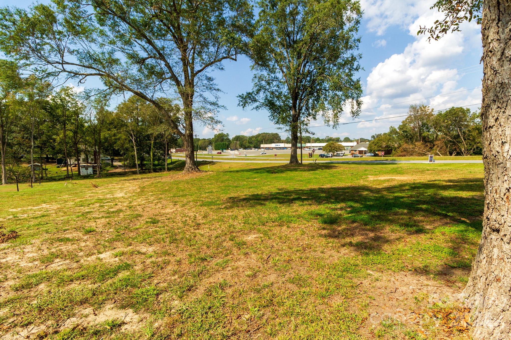 1301 Shelby Road Kings Mountain, NC 28086 - Photo 11 of 15 a view of a swimming pool with an outdoor space and seating area