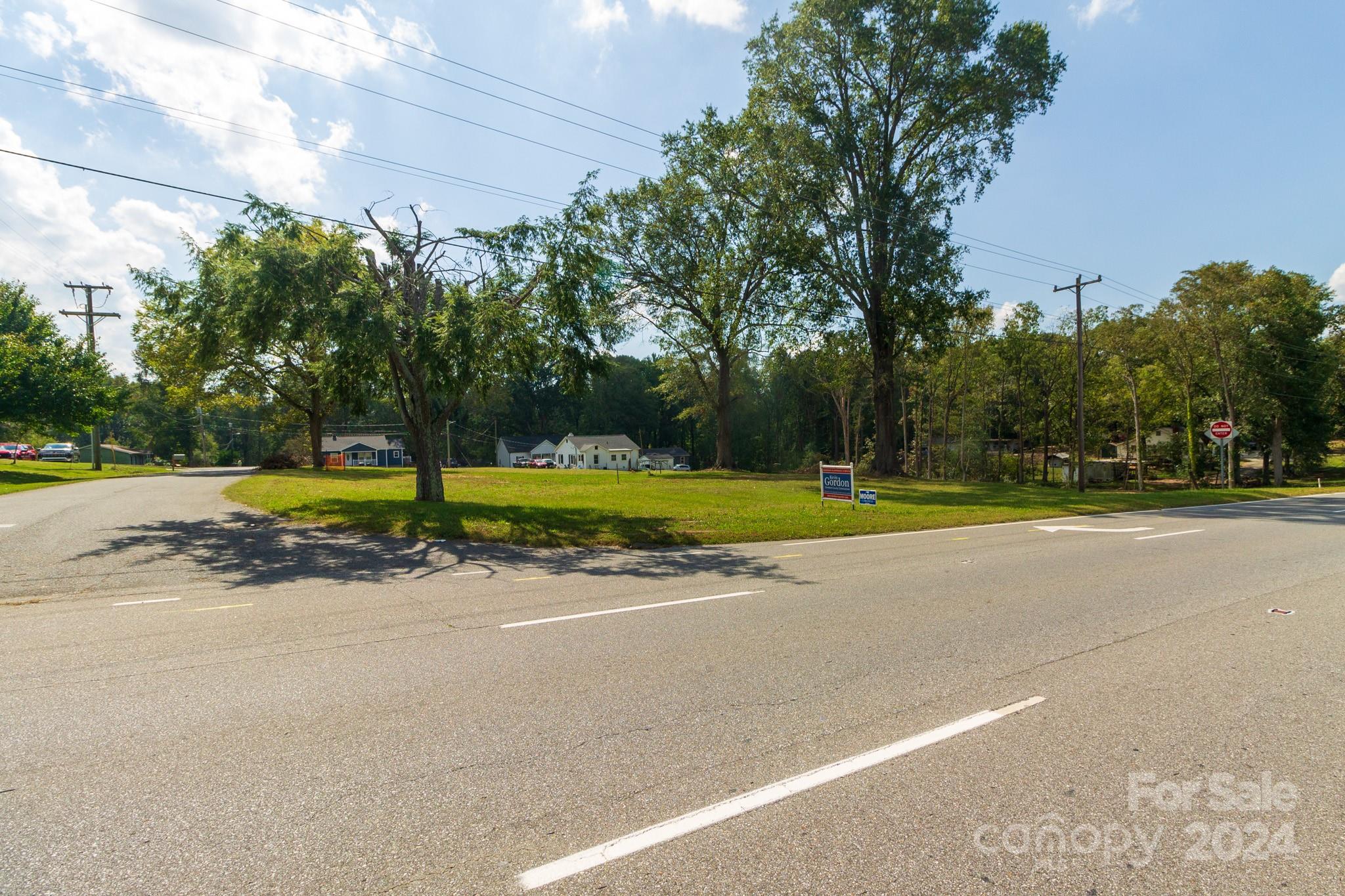 1301 Shelby Road Kings Mountain, NC 28086 - Photo 12 of 15 a view of a house with a big yard and palm trees