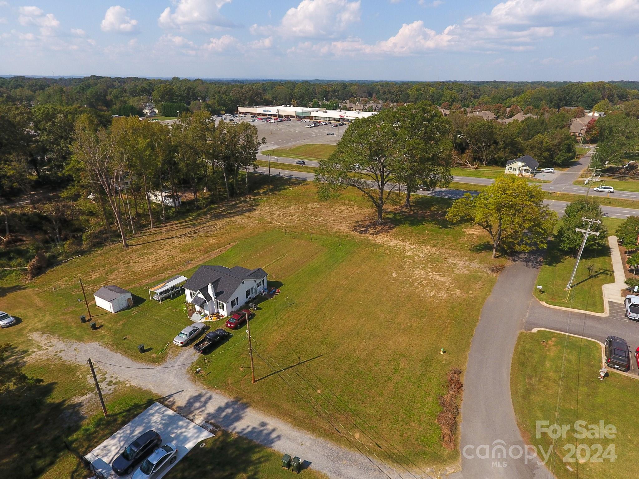 1301 Shelby Road Kings Mountain, NC 28086 - Photo 3 of 15 an aerial view of residential houses with outdoor space