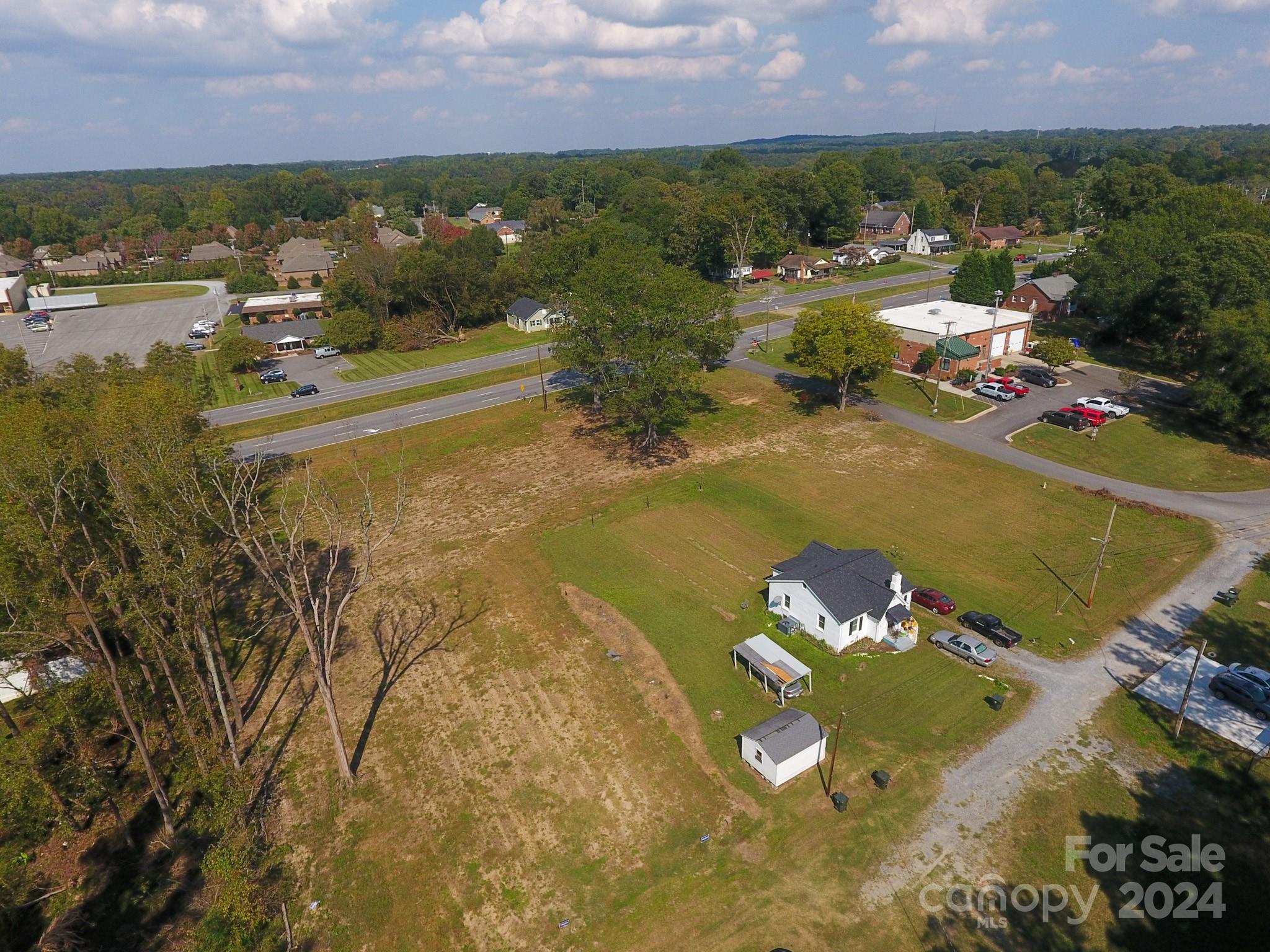 1301 Shelby Road Kings Mountain, NC 28086 - Photo 4 of 15 an aerial view of residential houses with outdoor space