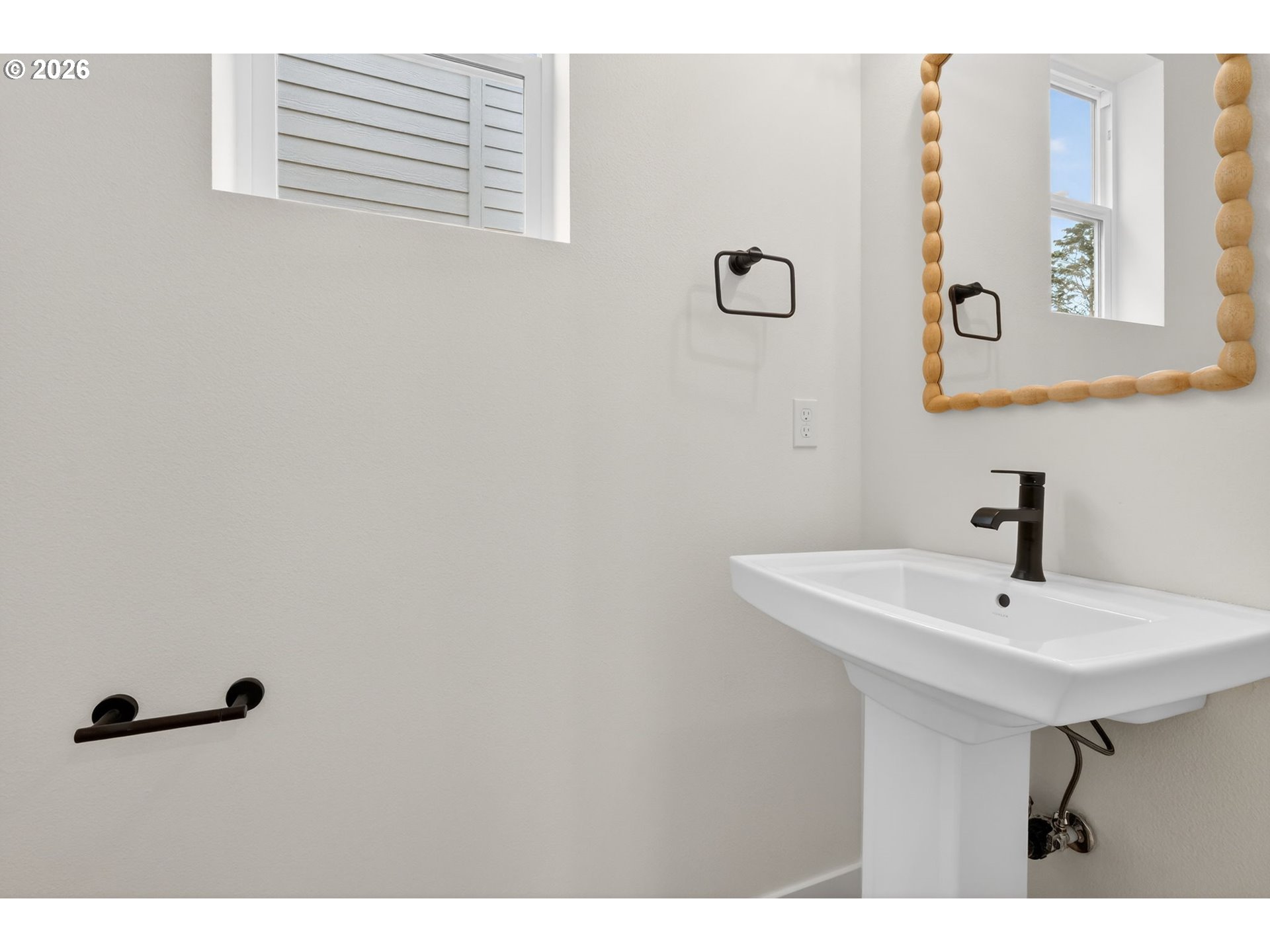 4055 Southwest McKinley Street, Unit 39 Gresham, OR 97080 - Photo 12 of 35 a bathroom with a sink and a mirror