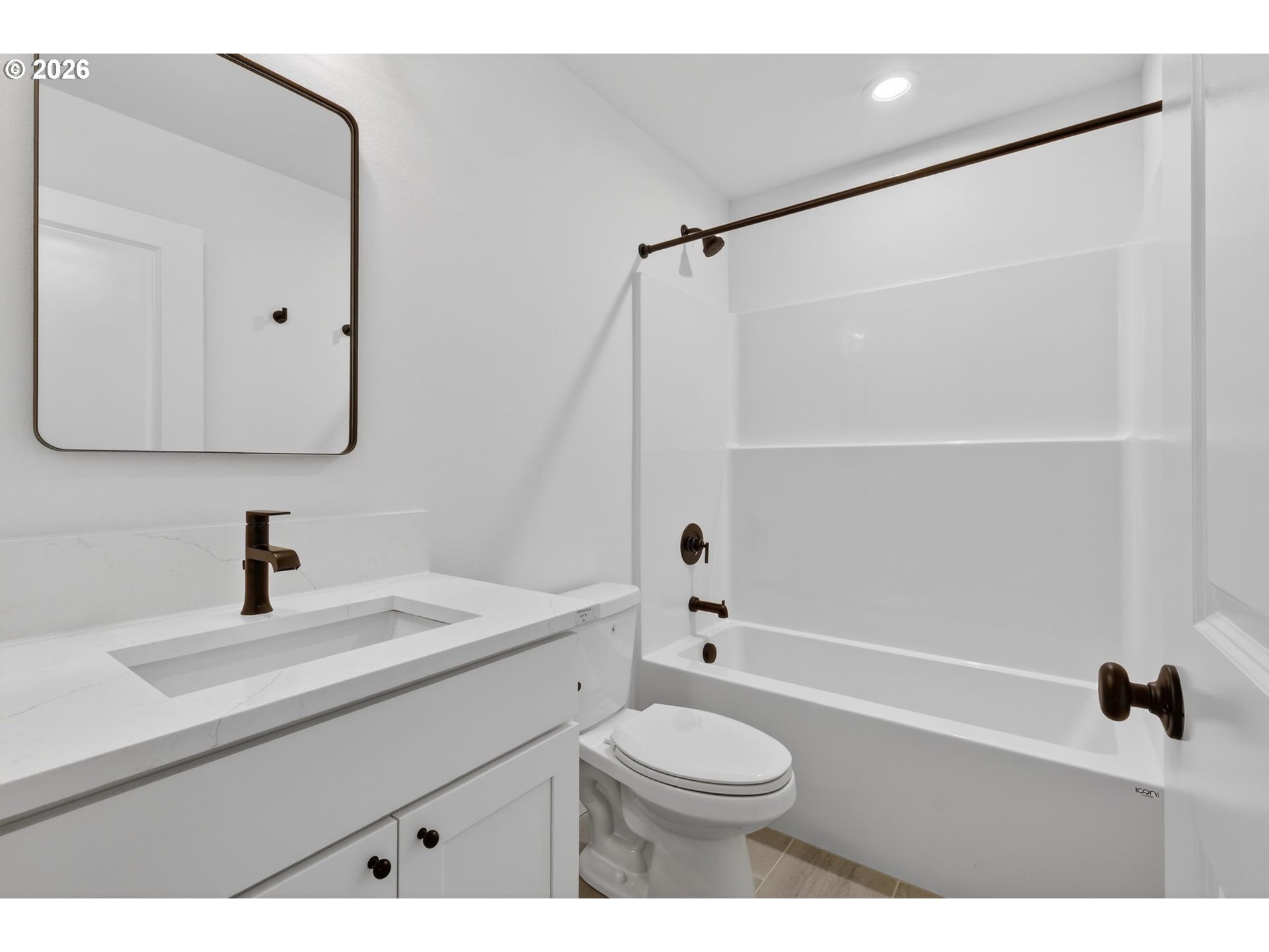 4055 Southwest McKinley Street, Unit 39 Gresham, OR 97080 - Photo 27 of 35 a bathroom with a sink a toilet and a mirror