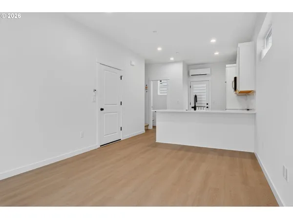 an aerial view of multi story residential apartment building with outdoor space and street view