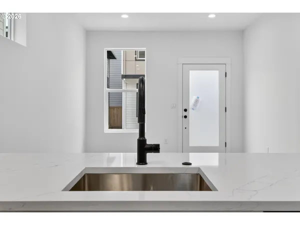 a view of a hallway with stairs