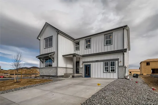 a front view of a house with a garage