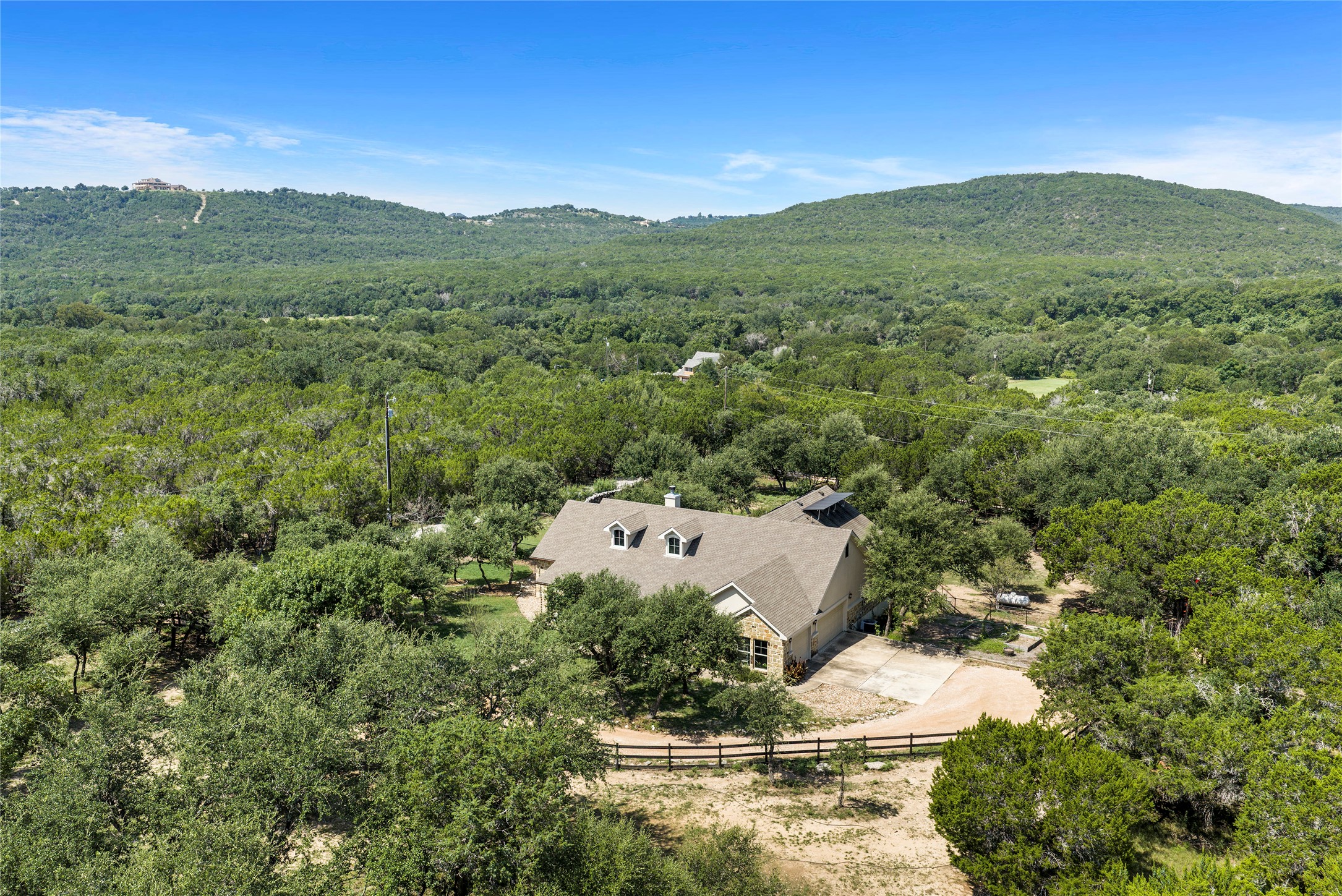 23224 Nameless Road Leander, TX 78641 - Photo 3 of 23 Perched on a verdant hillside, this residence offers tranquil, elevated views of the surrounding natural landscape.