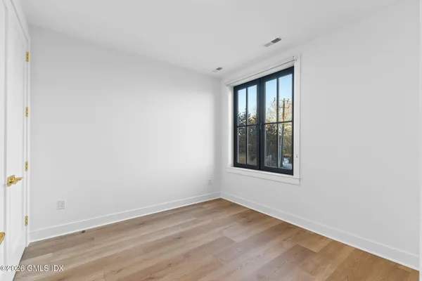 a view of a patio with chairs and a table