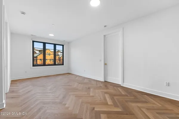 a kitchen with stainless steel appliances a sink and cabinets