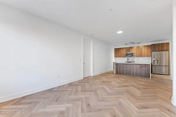 a view of an empty room with windows