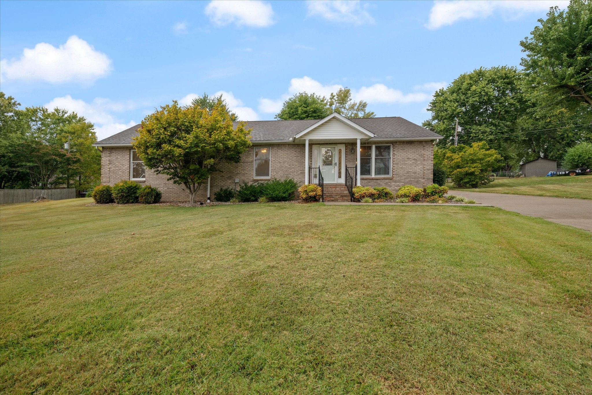 a front view of a house with a yard