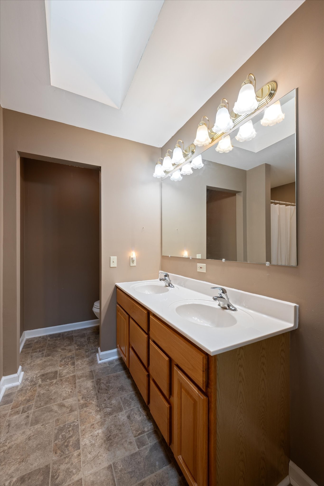 106 Lee Drive Springfield, TN 37172 - Photo 18 of 25 a bathroom with a double vanity sink and a mirror