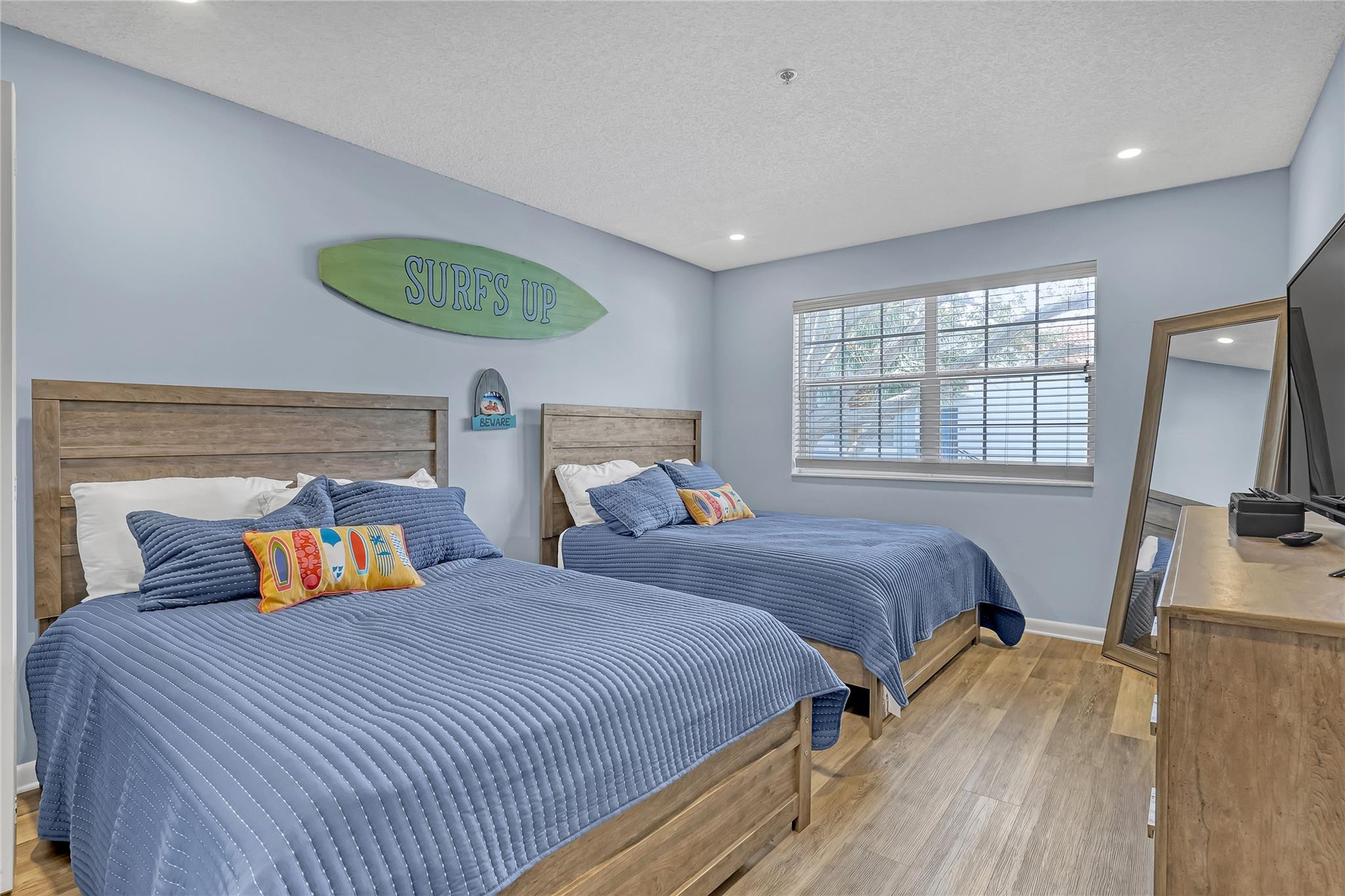 3143 Clint Moore Road, Unit 205 Boca Raton, FL 33496 - Photo 11 of 27 a bedroom with two beds and a large window