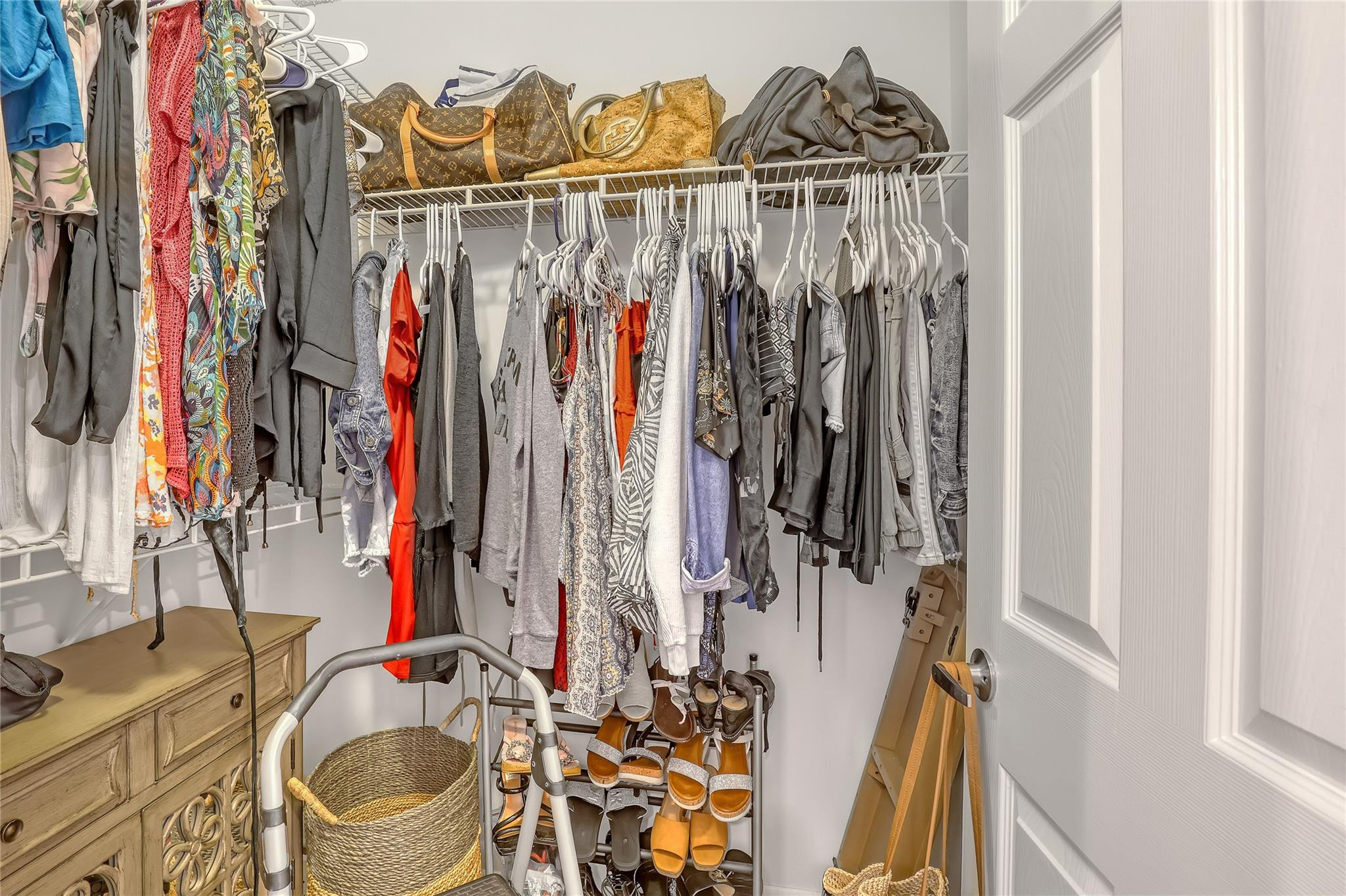 3143 Clint Moore Road, Unit 205 Boca Raton, FL 33496 - Photo 13 of 27 a view of walk in closet with clothes