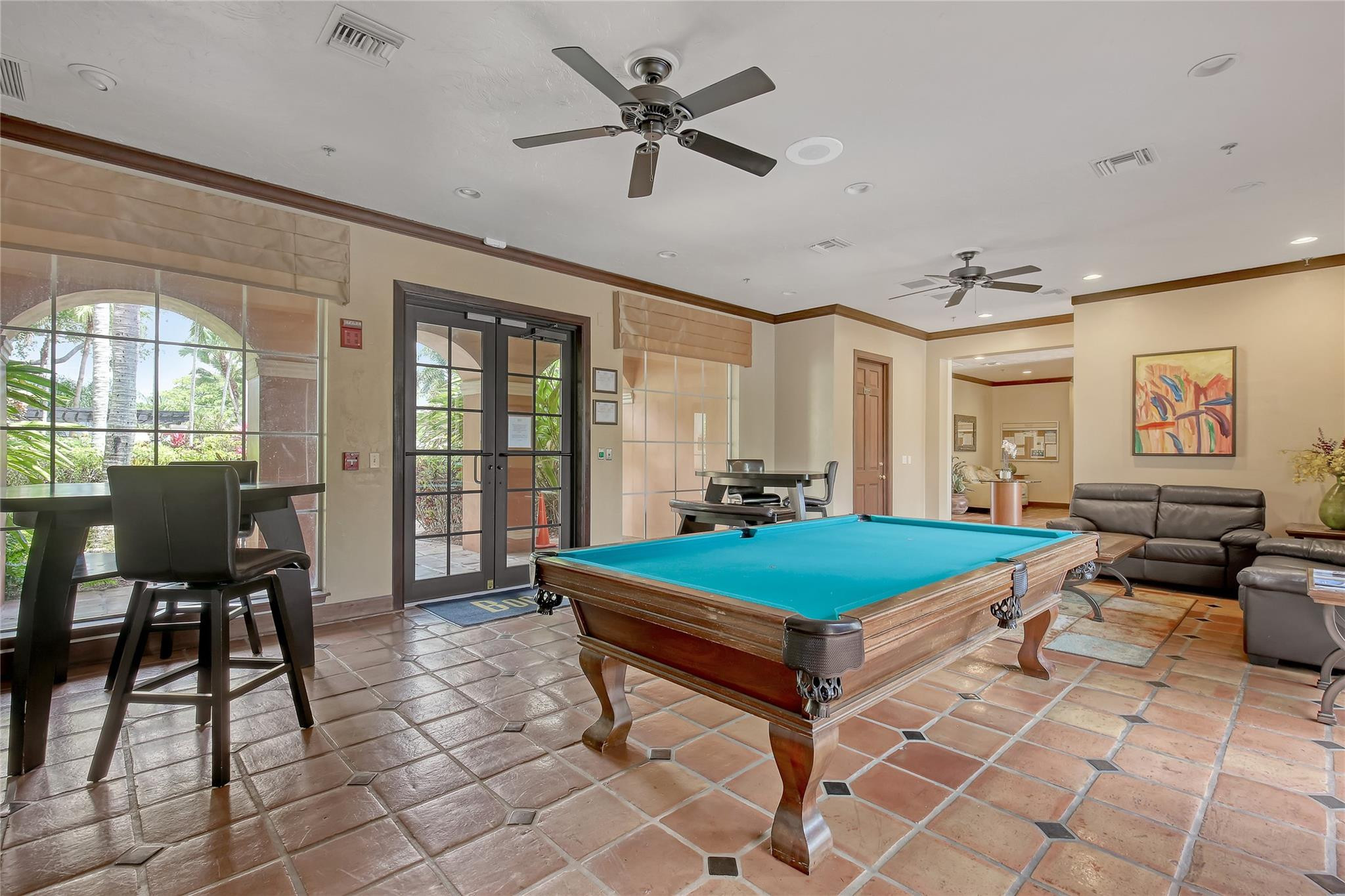 3143 Clint Moore Road, Unit 205 Boca Raton, FL 33496 - Photo 25 of 27 a room with pool table and windows