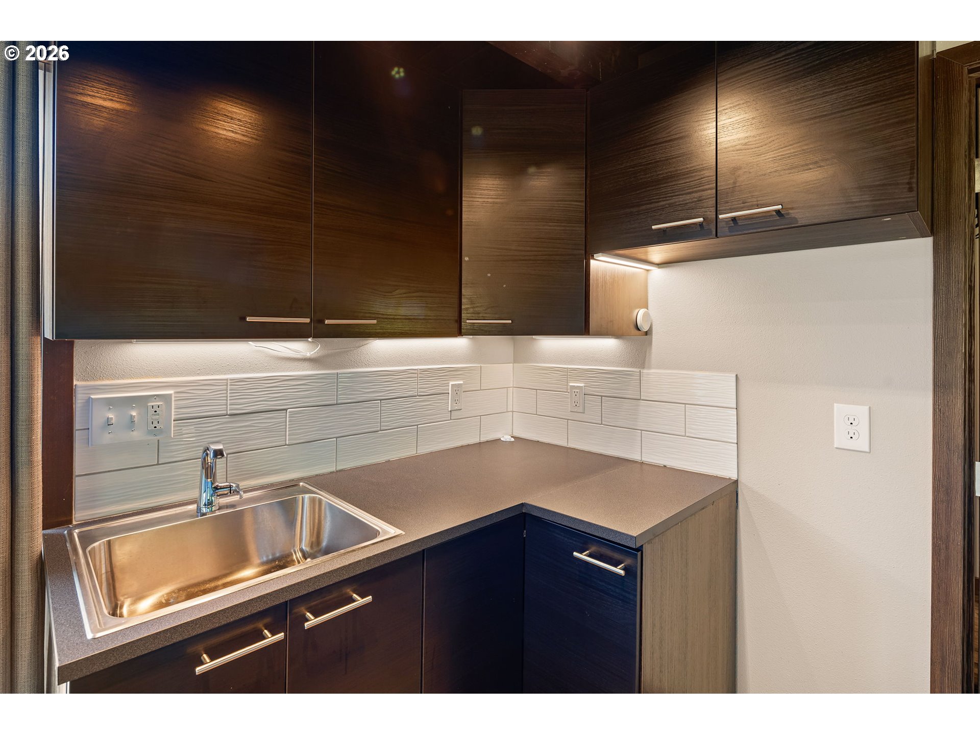 88481 1st Avenue Florence, OR 97439 - Photo 23 of 43 a kitchen with a sink and a refrigerator