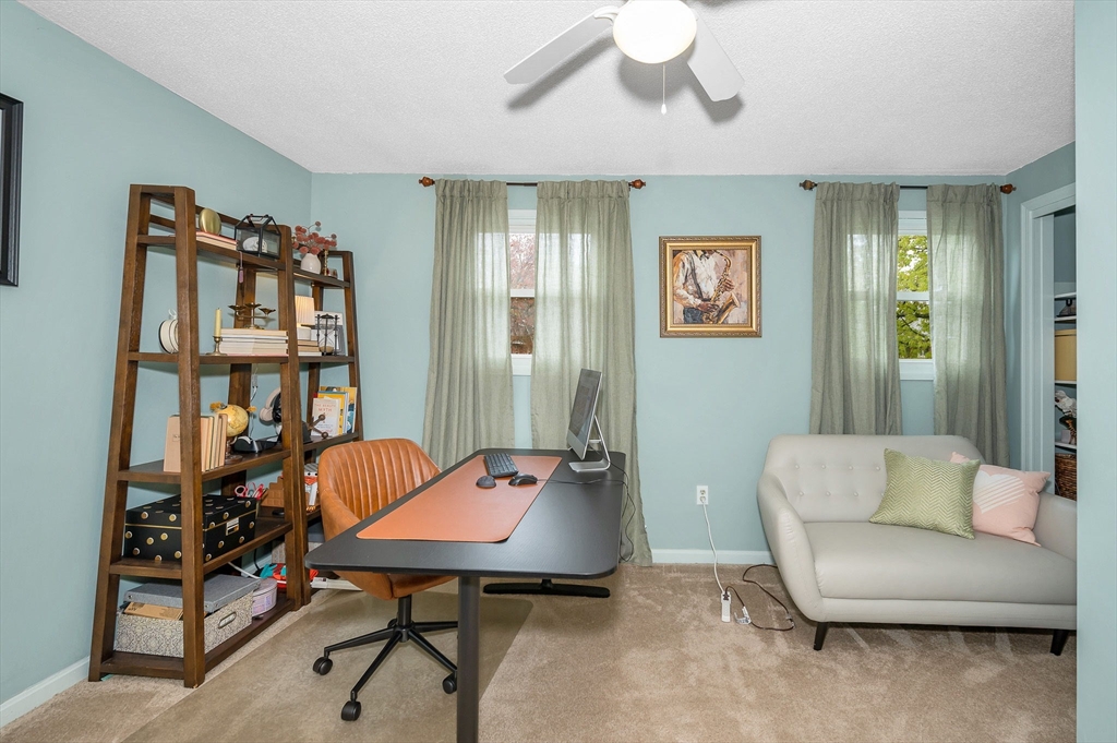 43 Constitution Way, Unit 43 Methuen, MA 01844 - Photo 20 of 25 a view of a livingroom with furniture and a window