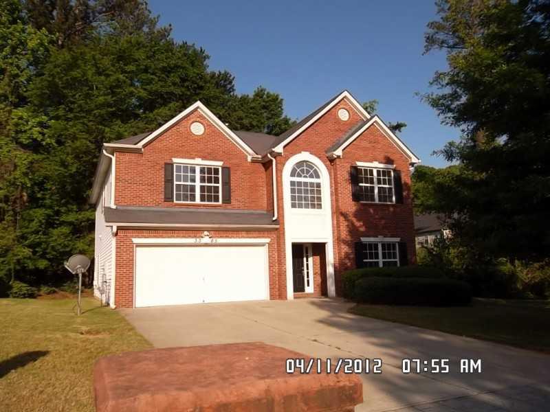 3385 Steeple Way Decatur, GA 30034 - Photo 1 of 1 a front view of a house with yard and trees
