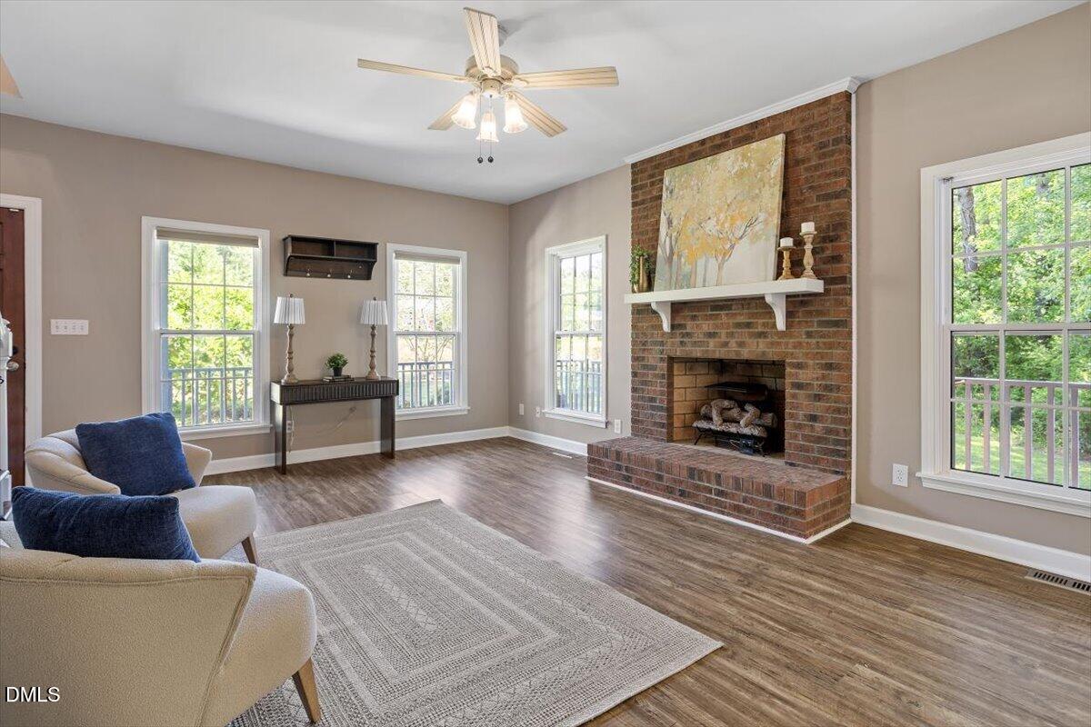 7505 Penny Road Raleigh, NC 27606 - Photo 13 of 35 a living room with furniture and a fireplace