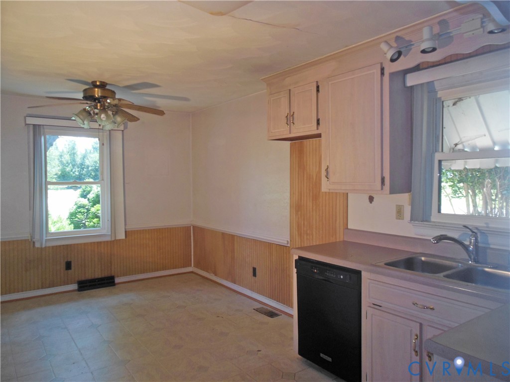 7146 Cold Harbor Road Mechanicsville, VA 23111 - Photo 11 of 26 a kitchen with white cabinets and window