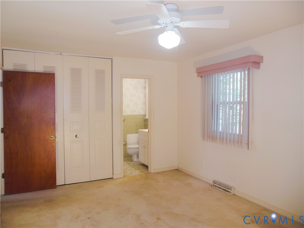 7146 Cold Harbor Road Mechanicsville, VA 23111 - Photo 17 of 26 an empty room with windows and fan