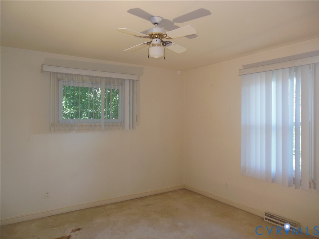 7146 Cold Harbor Road Mechanicsville, VA 23111 - Photo 20 of 26 an empty room with a window and a fan