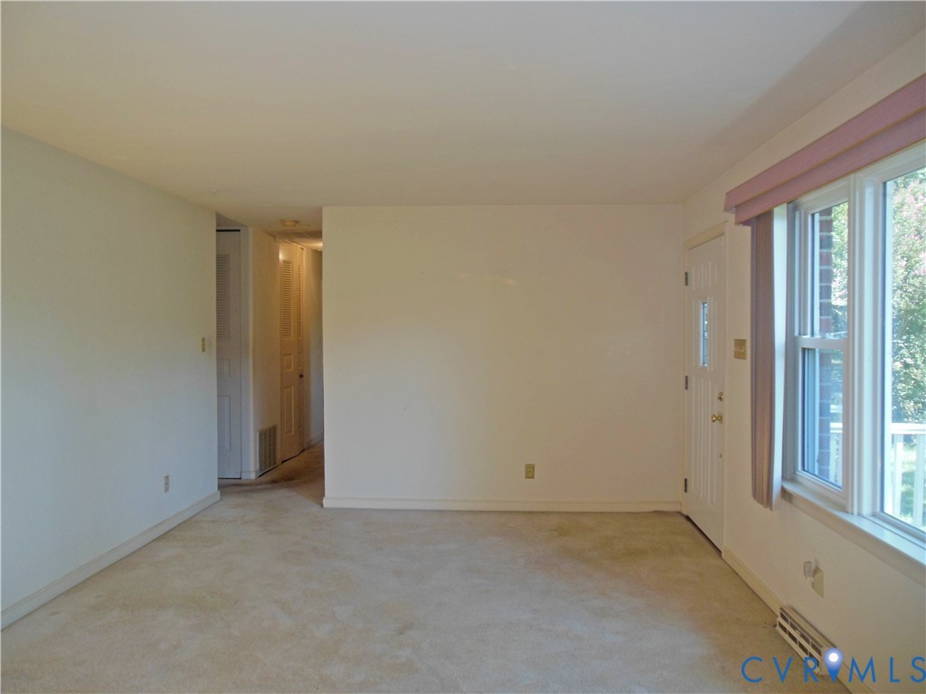 7146 Cold Harbor Road Mechanicsville, VA 23111 - Photo 7 of 26 an empty room with windows