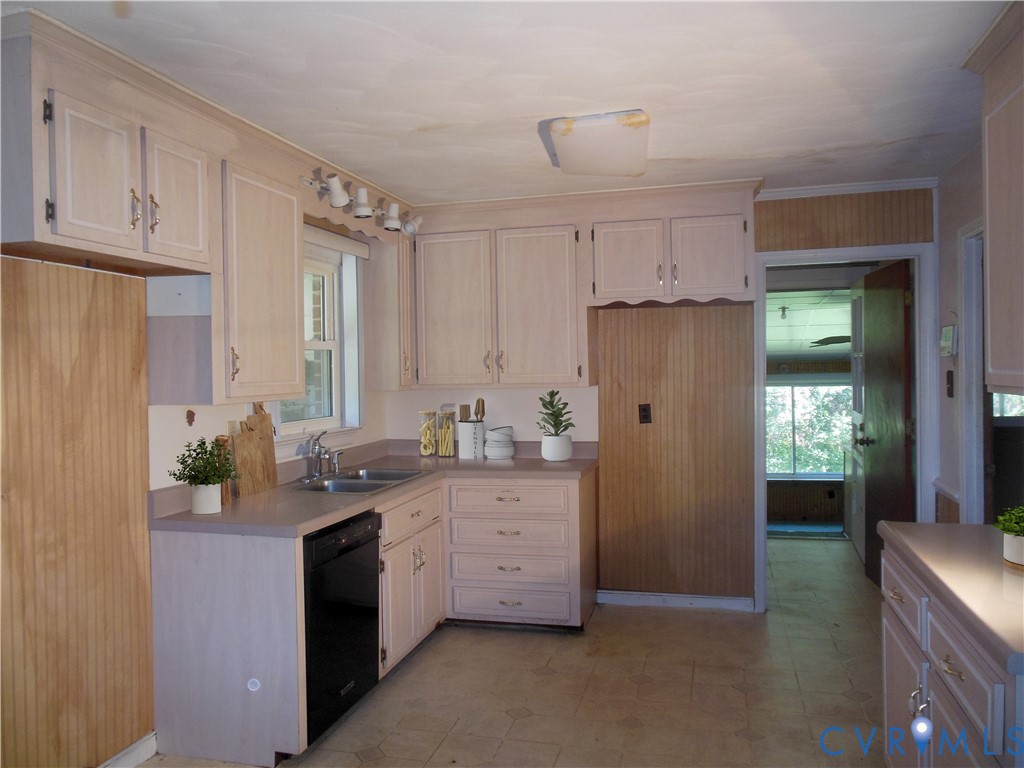 7146 Cold Harbor Road Mechanicsville, VA 23111 - Photo 8 of 26 a kitchen with stainless steel appliances granite countertop a refrigerator a sink dishwasher and white cabinets with wooden floor