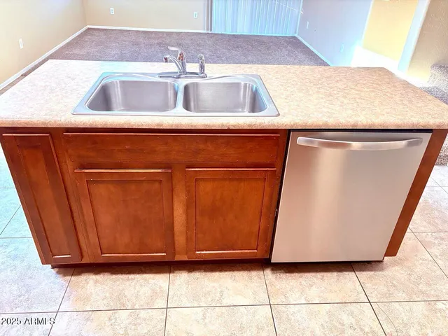 a kitchen with a sink and a microwave