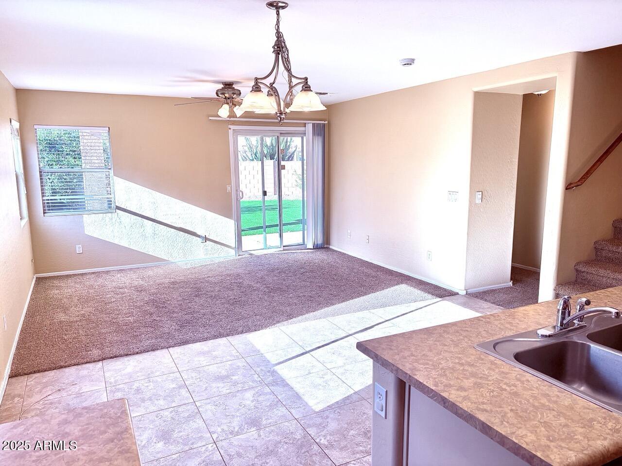 4014 East Superior Road San Tan Valley, AZ 85143 - Photo 12 of 36 a view of a kitchen with a sink and natural light