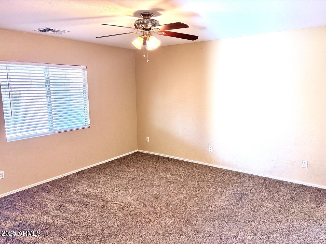 4014 East Superior Road San Tan Valley, AZ 85143 - Photo 18 of 36 an empty room with a window