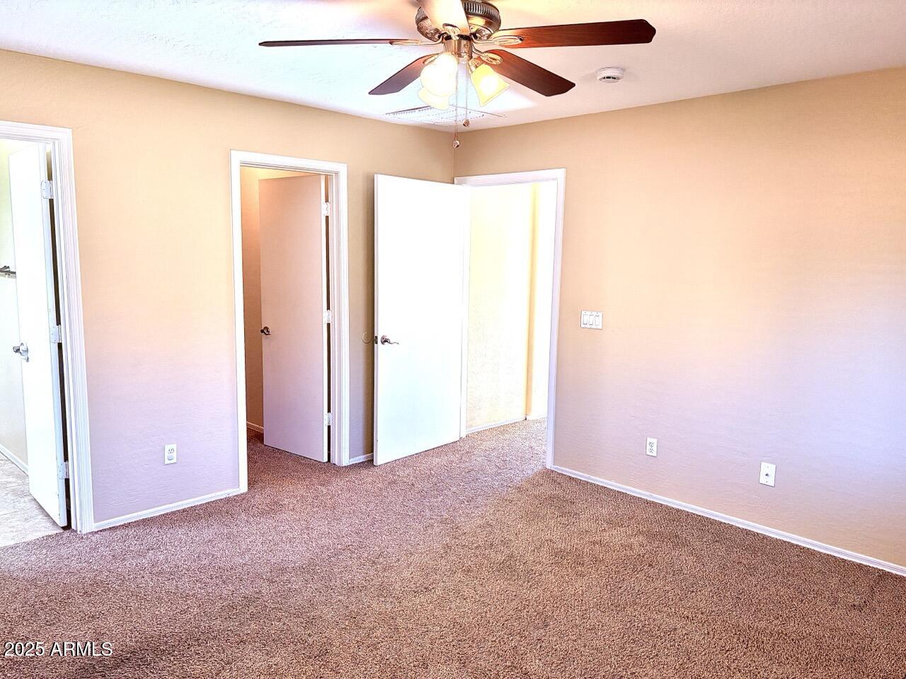 4014 East Superior Road San Tan Valley, AZ 85143 - Photo 20 of 36 an empty room with a ceiling fan and a window