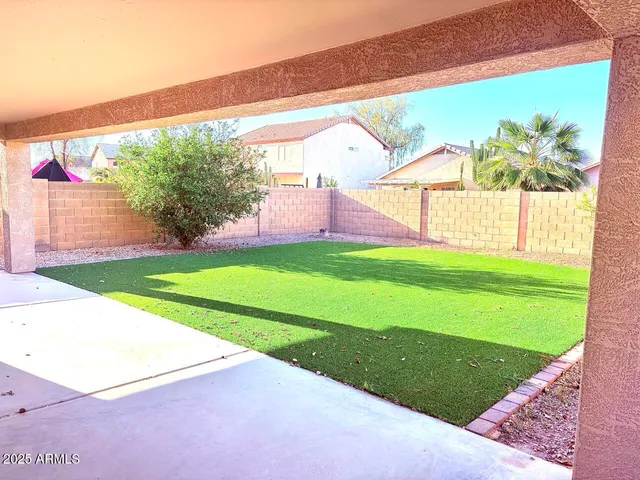 a view of a backyard with a garden and plants