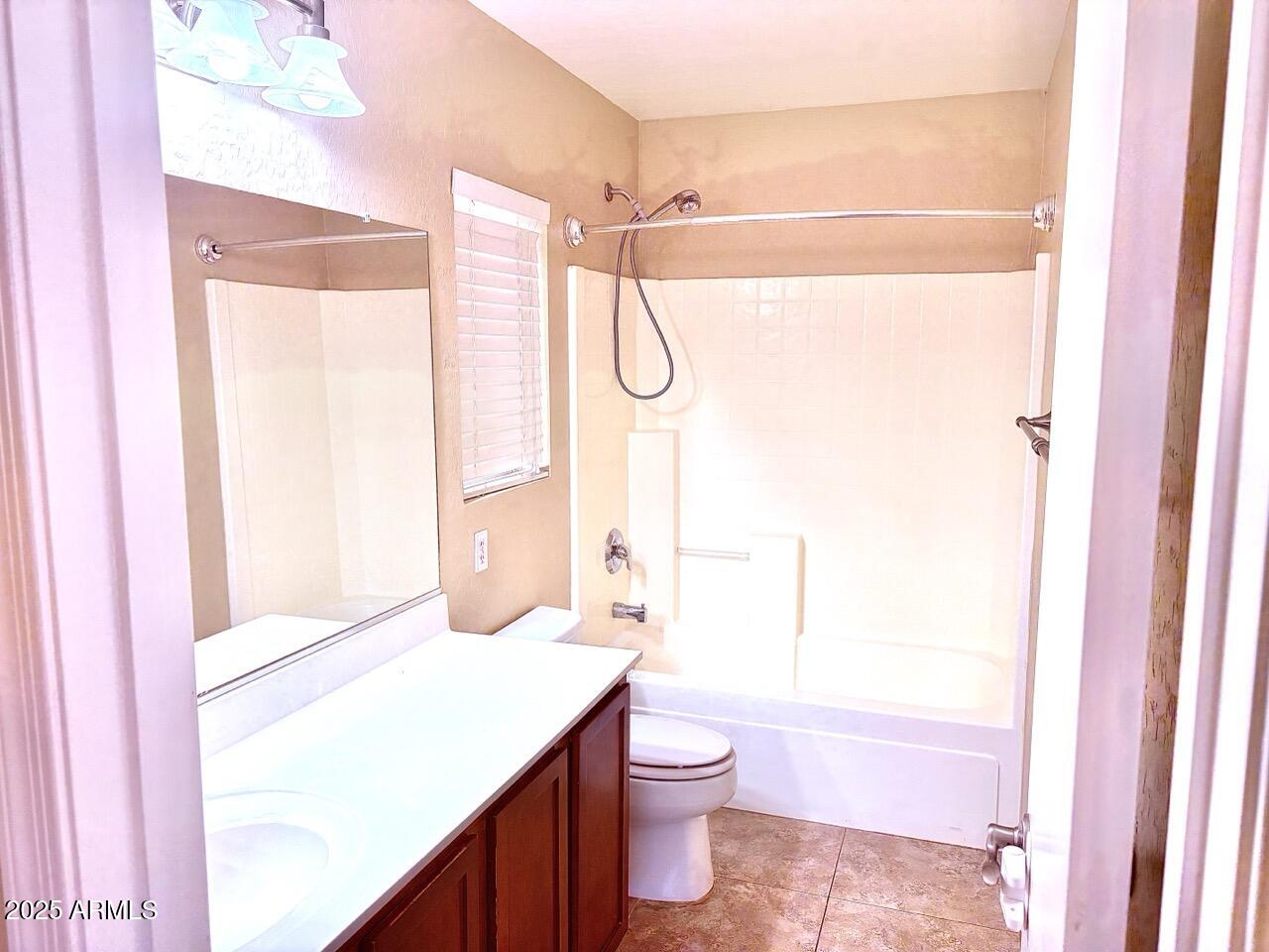 4014 East Superior Road San Tan Valley, AZ 85143 - Photo 21 of 36 a bathroom with a granite countertop sink toilet and shower